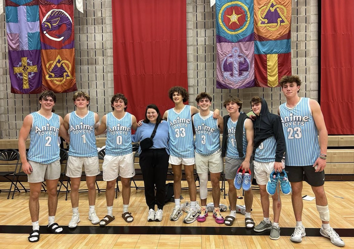 Anime Lovers, a team consisting of junior boys, poses with Ms. Babb