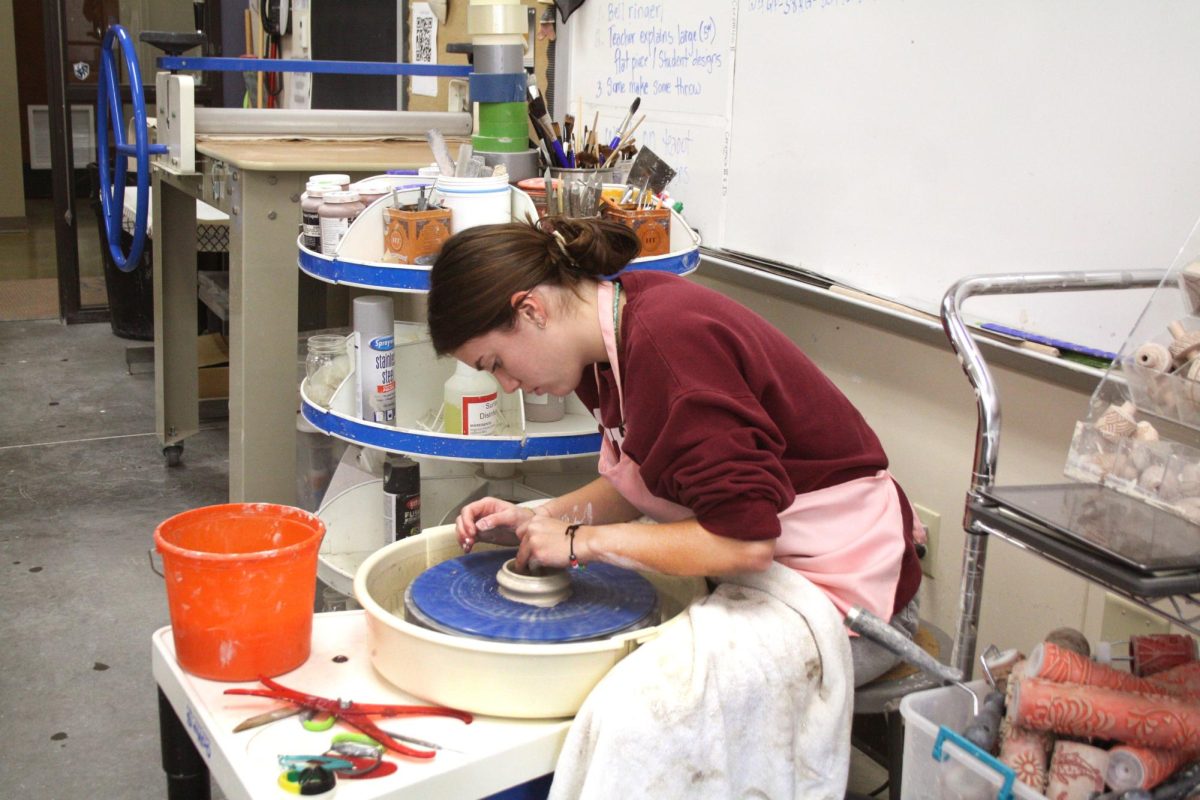 Senior Lainey Ridings shapes a pot in Ceramics III. Ceramics III is open only to seniors.
